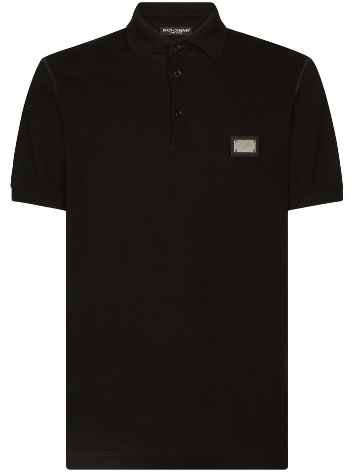 Polo mezza manica con logo plachetta