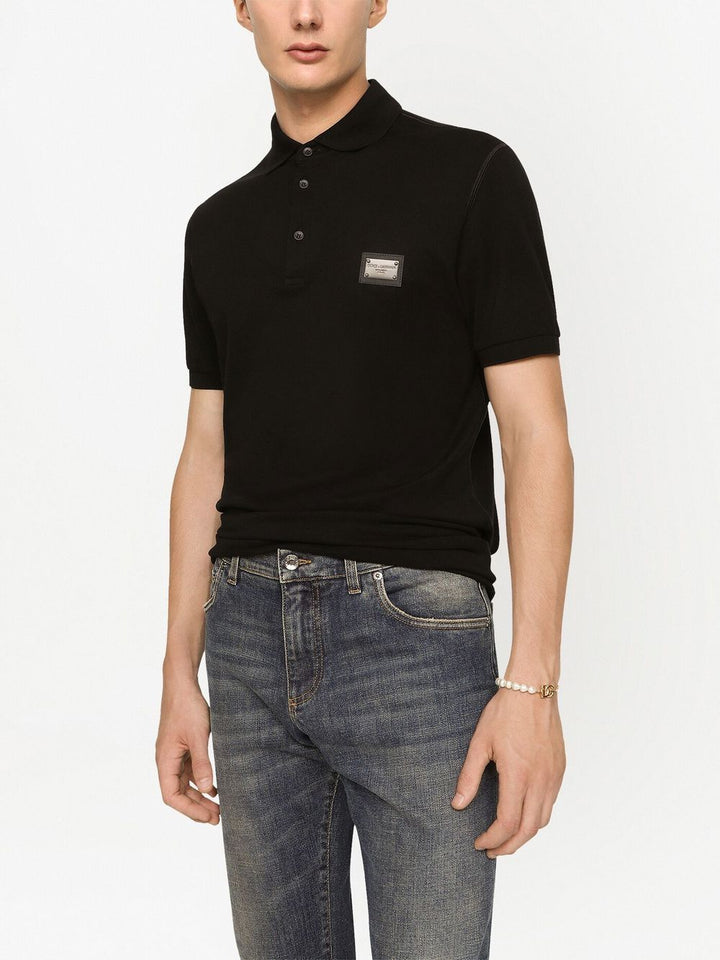 Polo mezza manica con logo plachetta