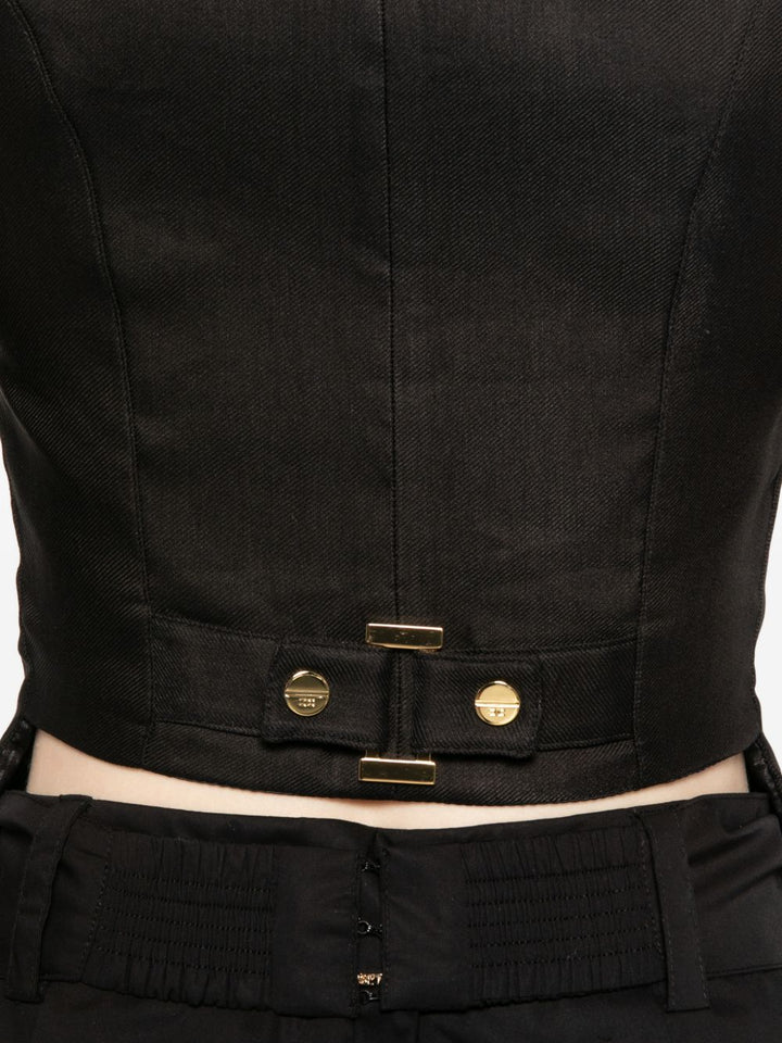 Gilet con bottoni e taschini e scollo a V