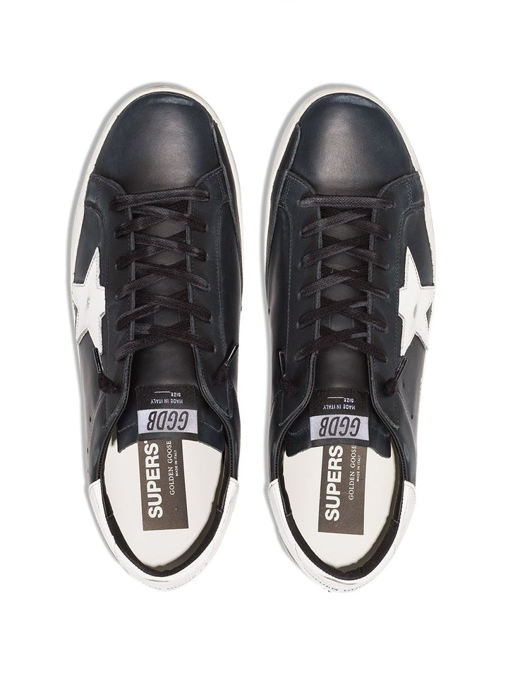 Sneakers Superstar nera  effetto pelle vissuta