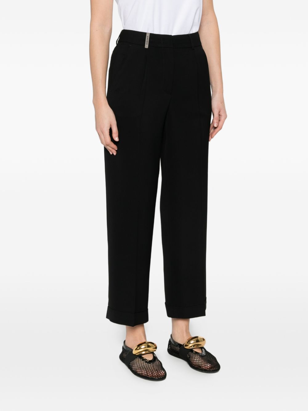 Pantalone con pieghe e dettaglio tasche