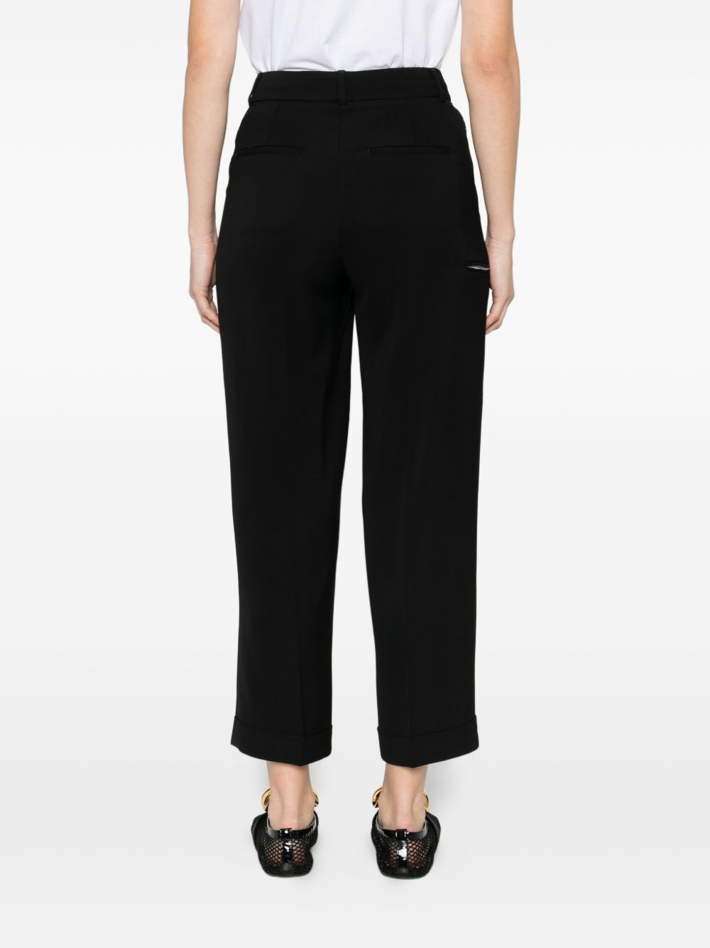 Pantalone con pieghe e dettaglio tasche