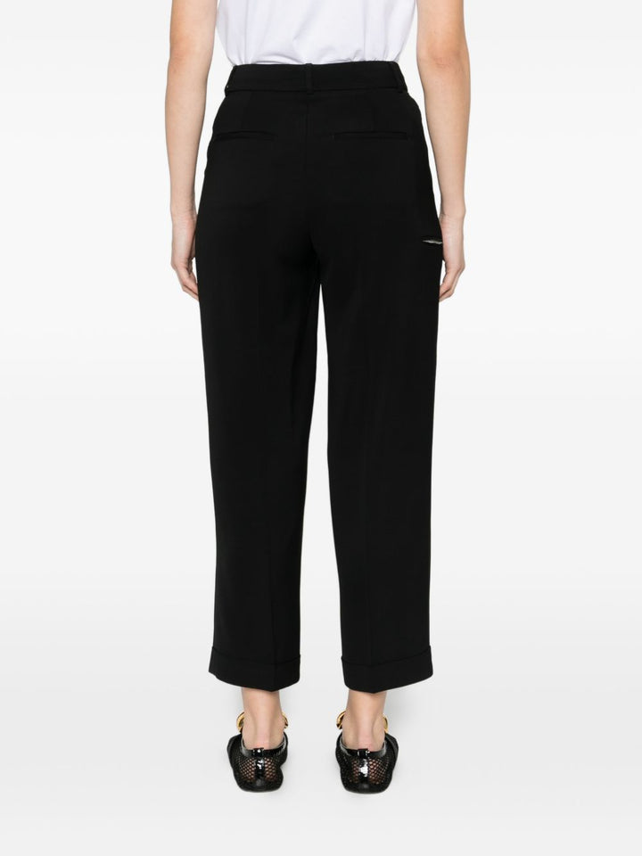 Pantalone con pieghe e dettaglio tasche