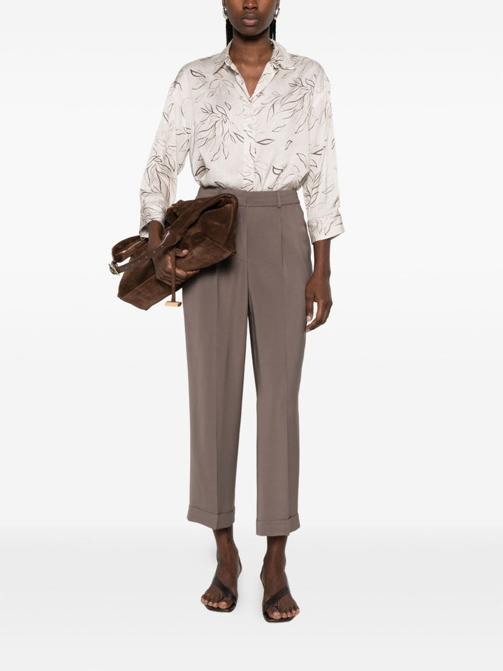 Pantalone con pieghe e dettaglio tasche
