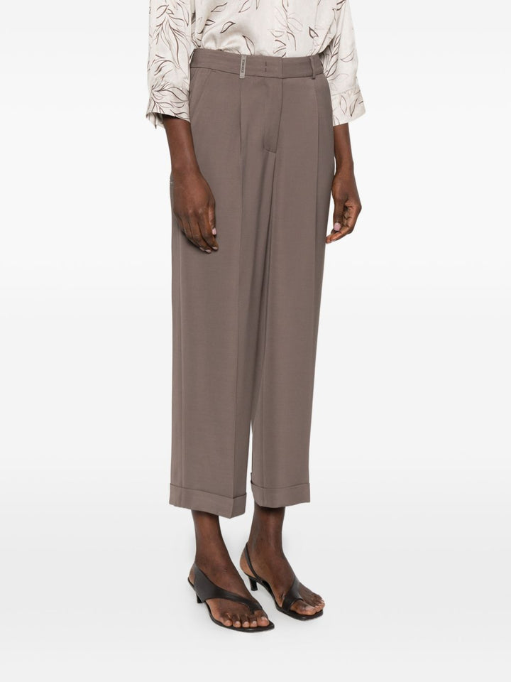 Pantalone con pieghe e dettaglio tasche