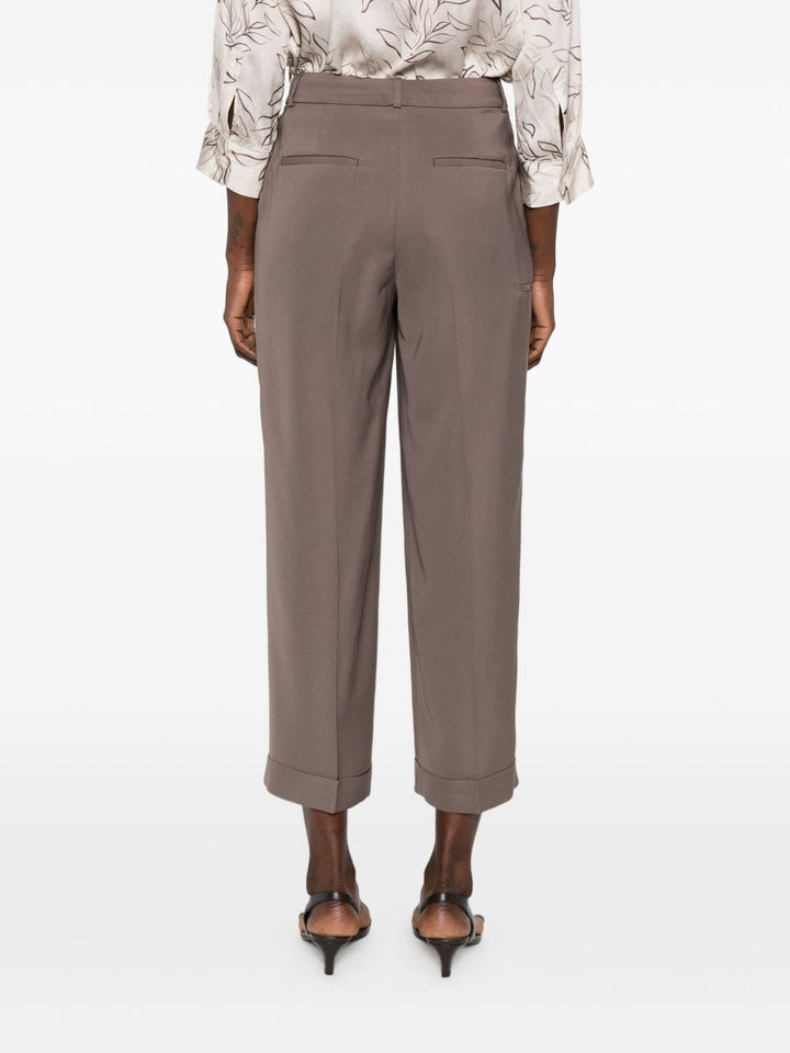 Pantalone con pieghe e dettaglio tasche
