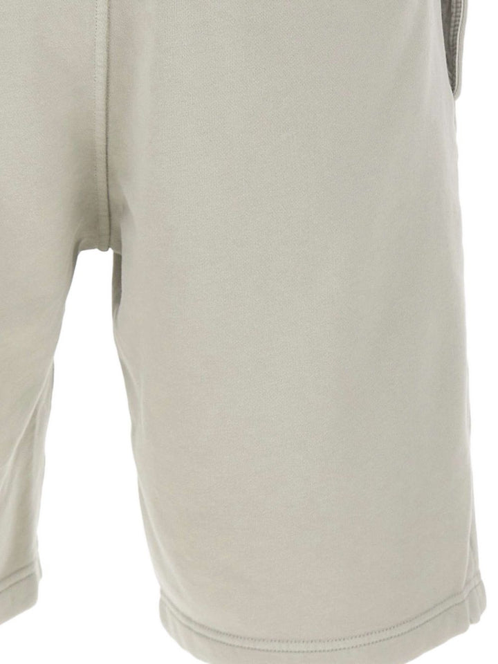 Pantaloni affusolati con applicazione Compass