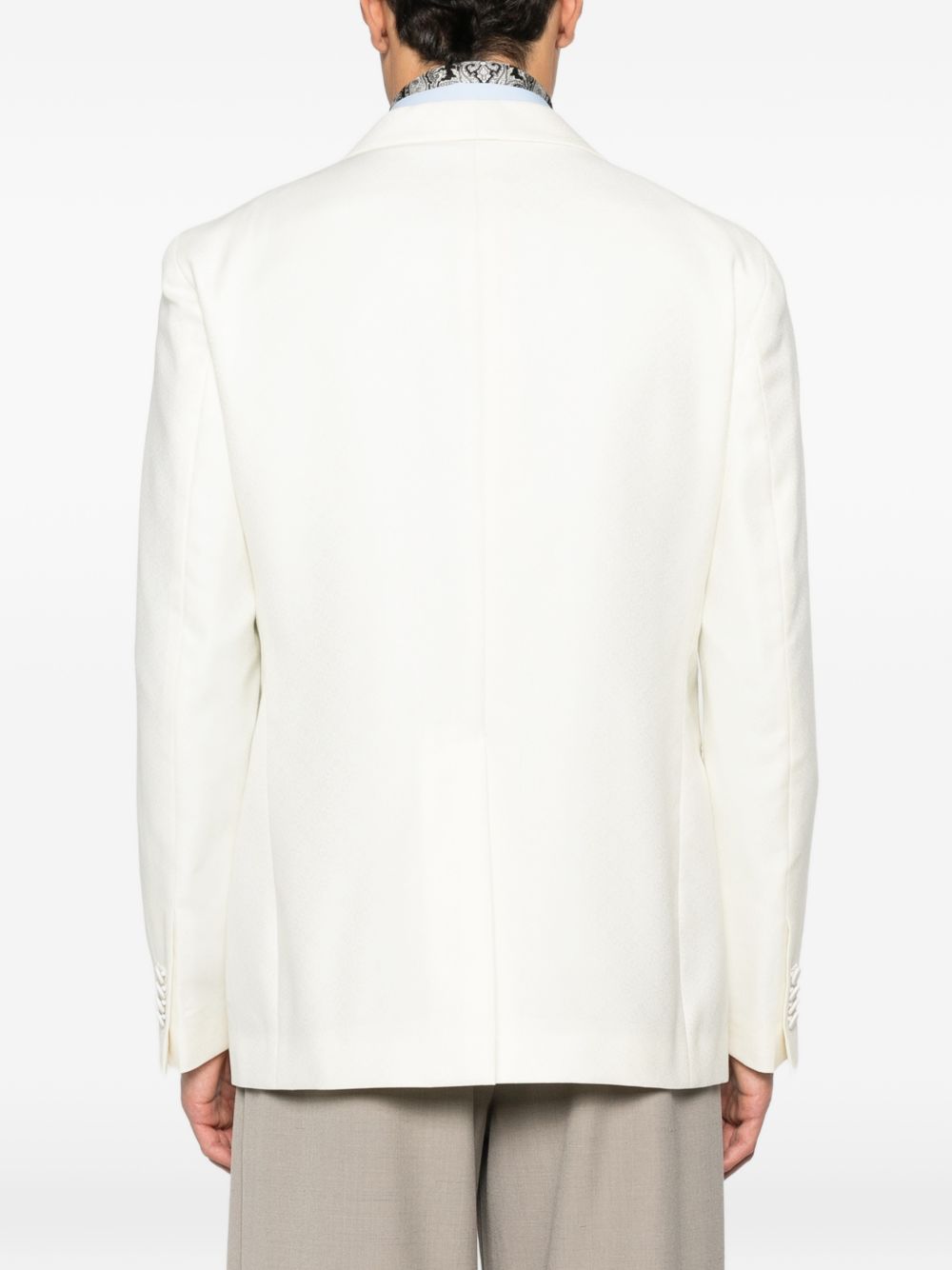 Giacca monopettocon tasche dritte a filetto e spacco centrale