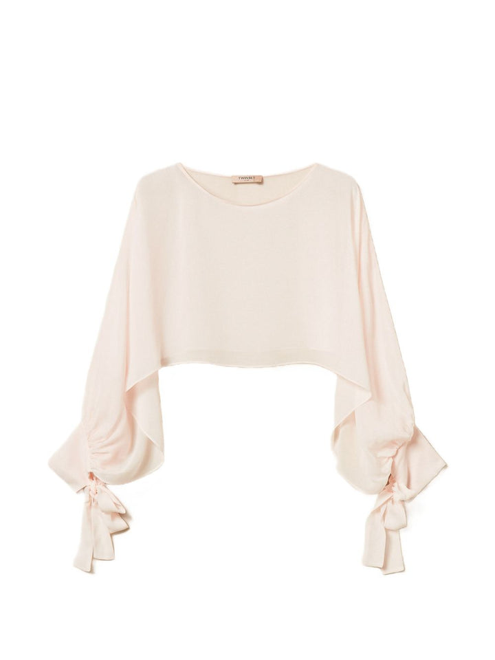 Blusa crop con fiocco